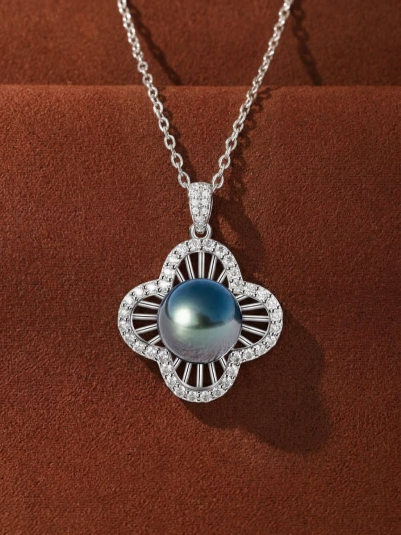 Chalice Tahitian Mabe Pearl Quatrefoil Single Pendant Necklace featuring a lustrous black pearl surrounded by a diamond-accented quatrefoil frame on a silver chain.