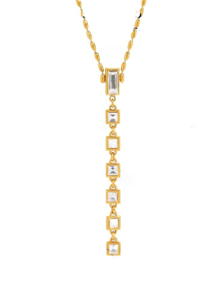 Lagoon Layers - Freshwater Pearl Turquoise Drop Layered Necklace featuring a gold-tone chain with a drop pendant adorned with baguette and square cut clear cubic zirconia stones.