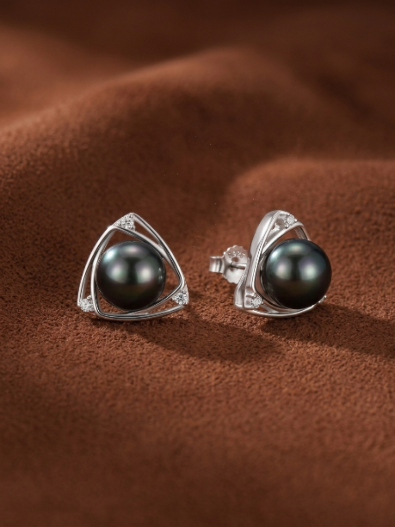 Vertex Tahitian Pearl Triangle Stud Earrings feature a lustrous 11mm black pearl set in a polished metal triangular frame with pavé accents.