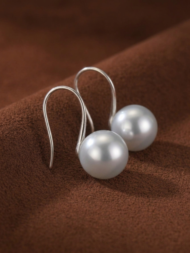 Alight Akoya Pearl Hoop Earrings featuring a single lustrous 9mm black pearl on a delicate silver hoop.