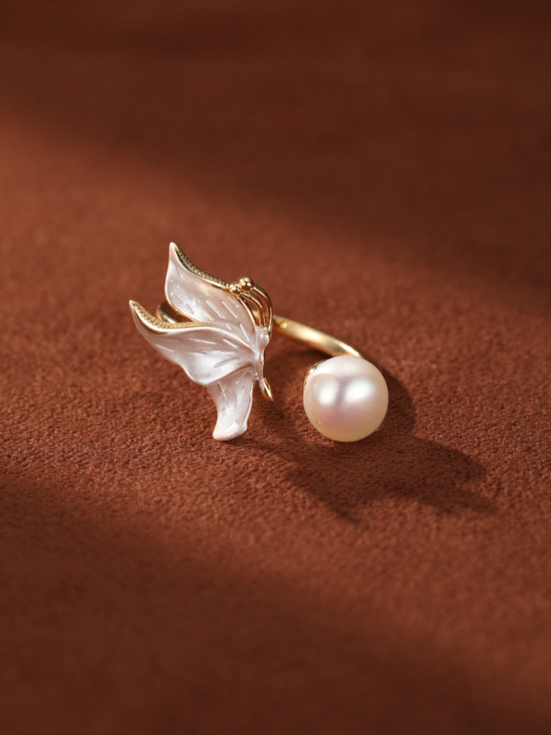 Chrysalis Freshwater Pearl Butterfly Cuff Ring featuring delicate white butterfly wings and a lustrous 8.5 mm white button freshwater pearl on a gold-toned cuff