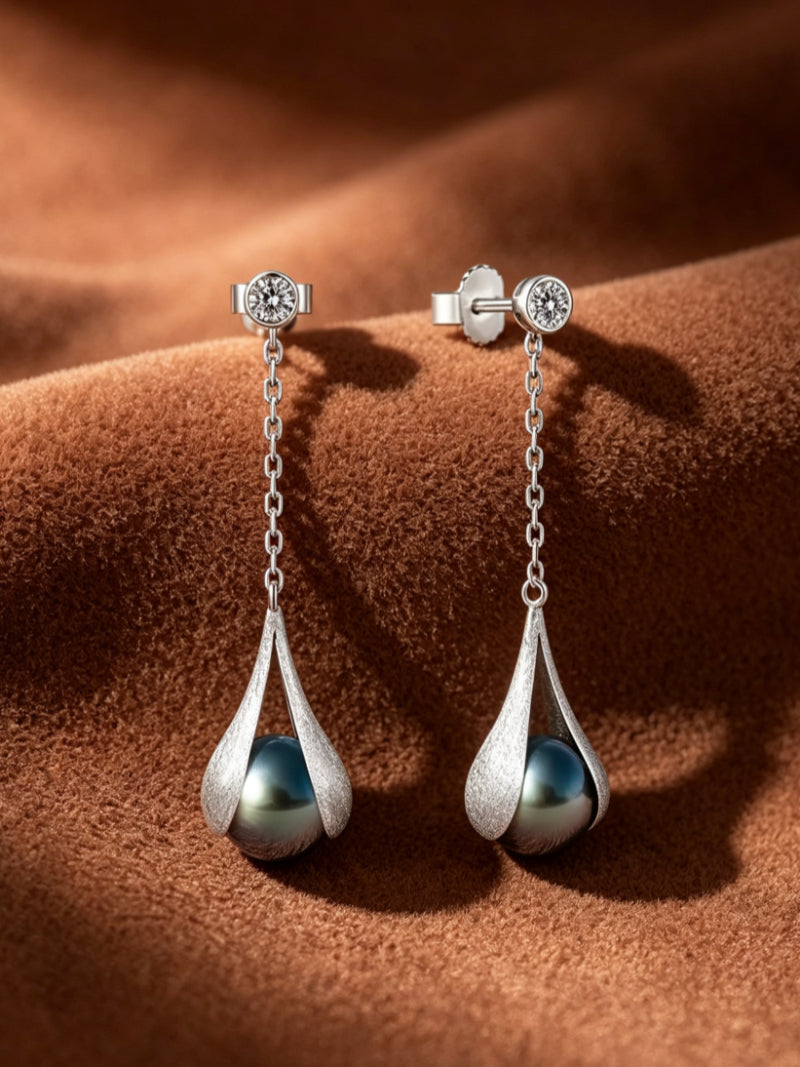 Enfold Tahitian pearl drop earrings with a silver-tone textured setting and clear stone stud.
