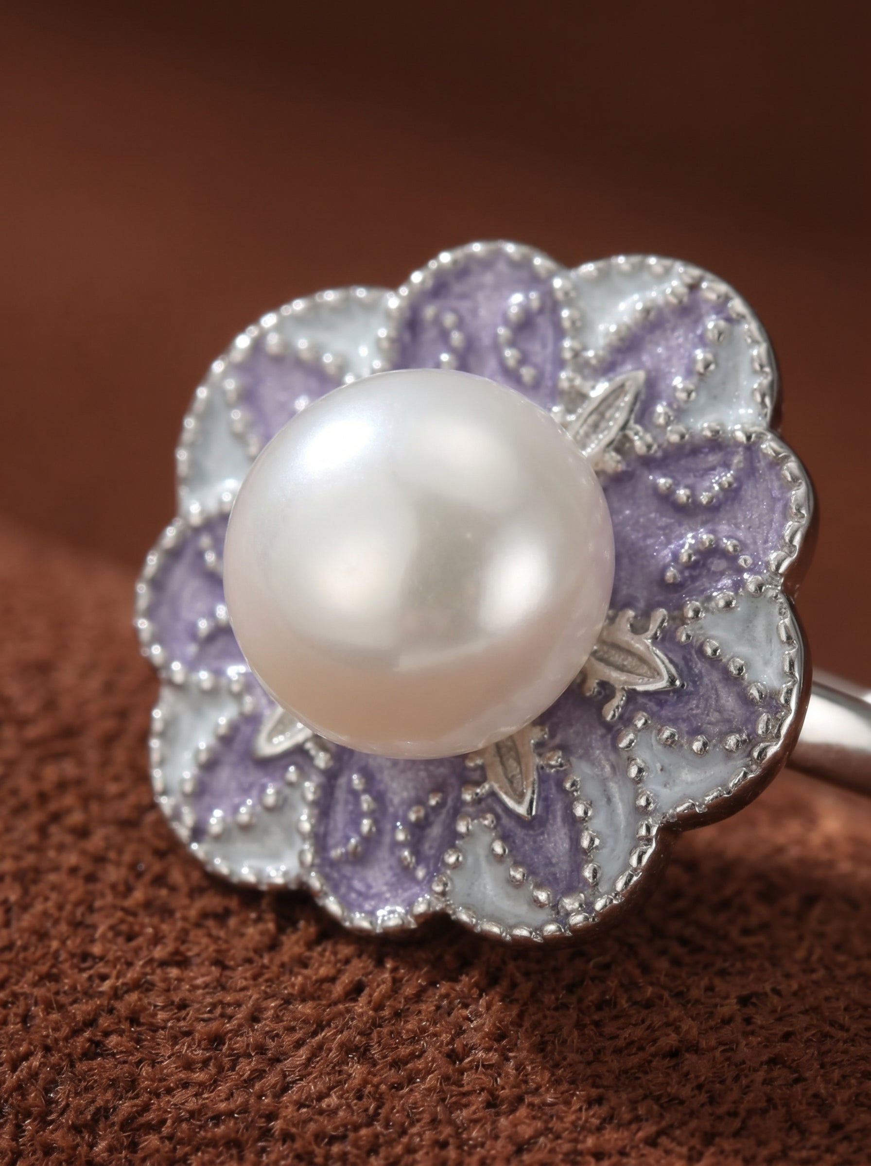 Flora freshwater pearl flower cuff ring with a purple and white enameled flower design and a white pearl centerpiece @pearl