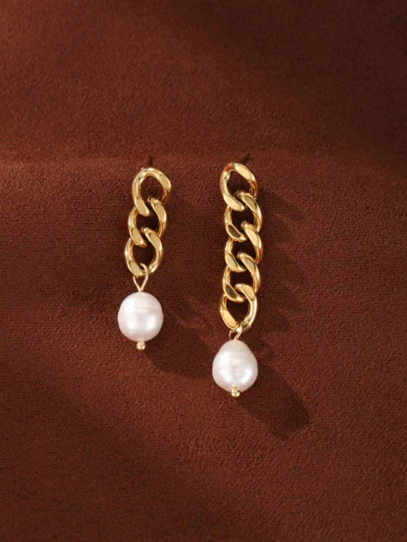 Gold-toned chain dangle earrings featuring a white freshwater pearl on each.