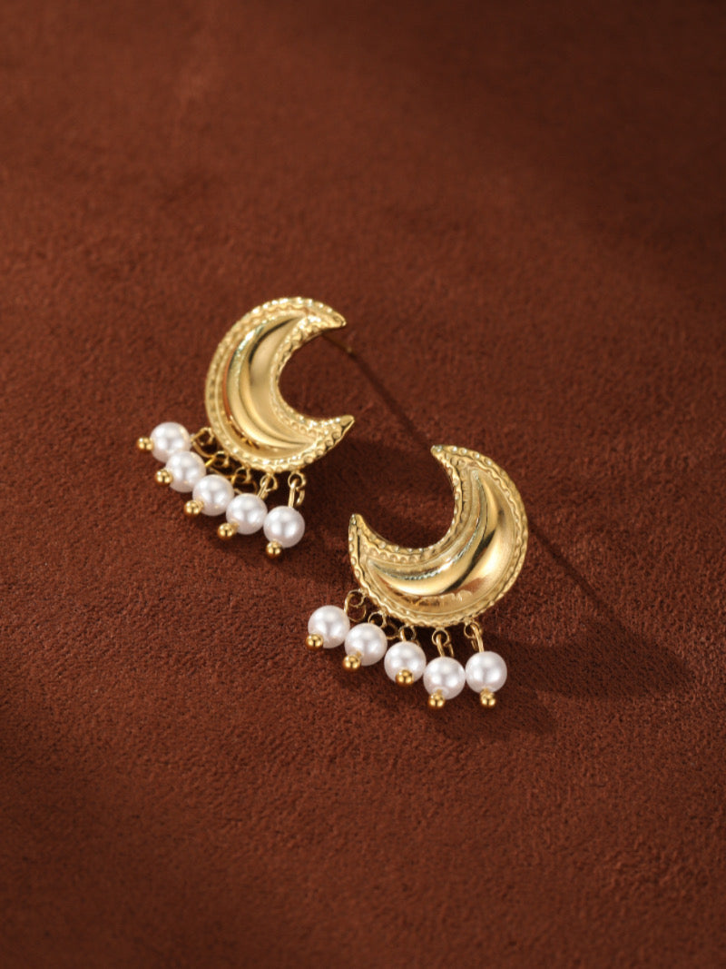 Halcyon gold-toned crescent moon drop earrings featuring delicate white freshwater pearls