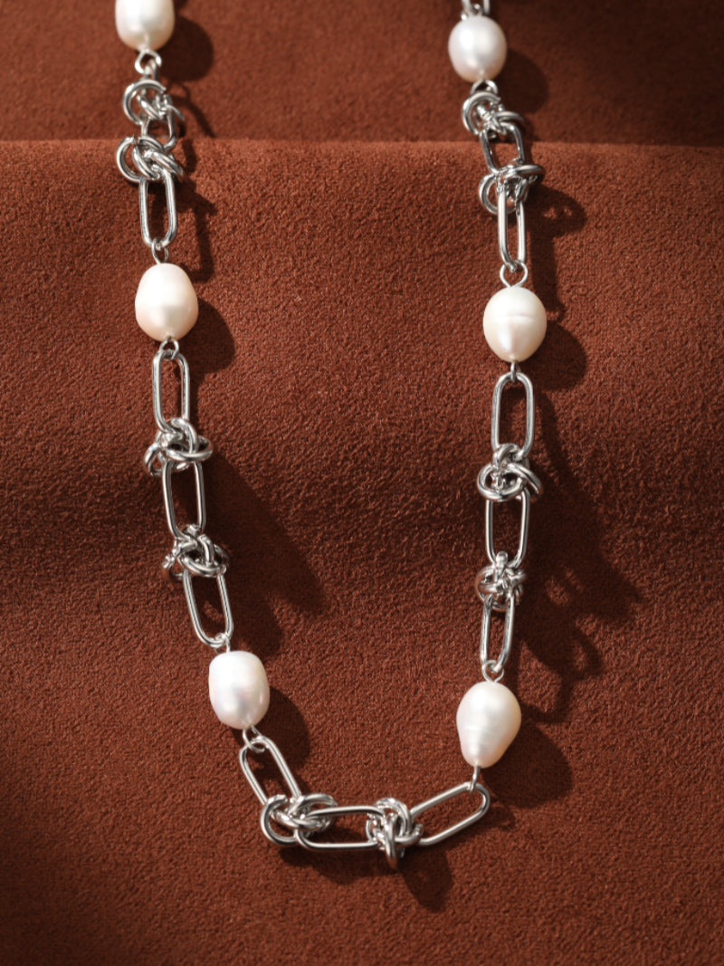 Interlace Choker Necklace featuring 8mm freshwater white drop pearls interspersed with silver chain links and knots. @pearl