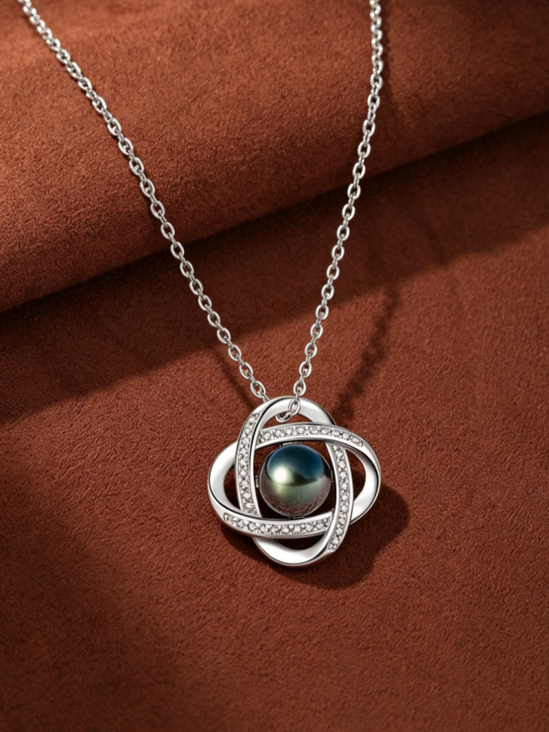 Interstellar necklace with a Tahitian pearl in a cubic zirconia-accented quatrefoil pendant, crafted from sterling silver. @pearl