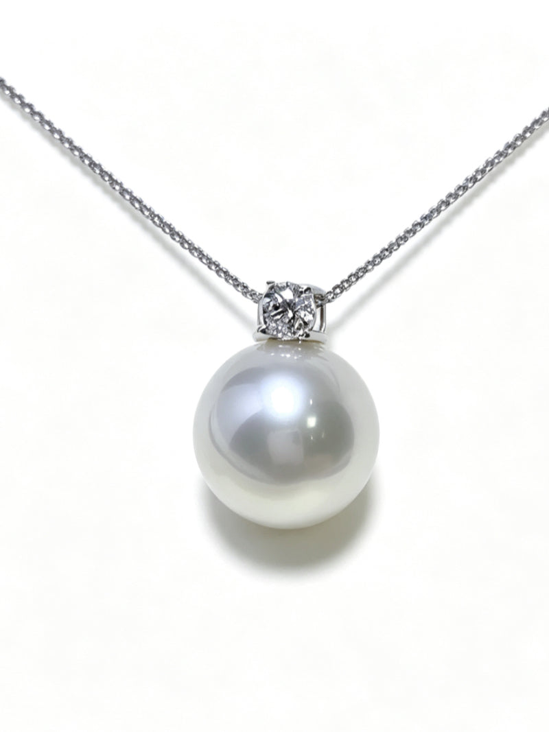 Lumin South Sea pearl chain drop necklace featuring a large, lustrous white pearl suspended from a delicate silver chain with a sparkling diamond accent.
