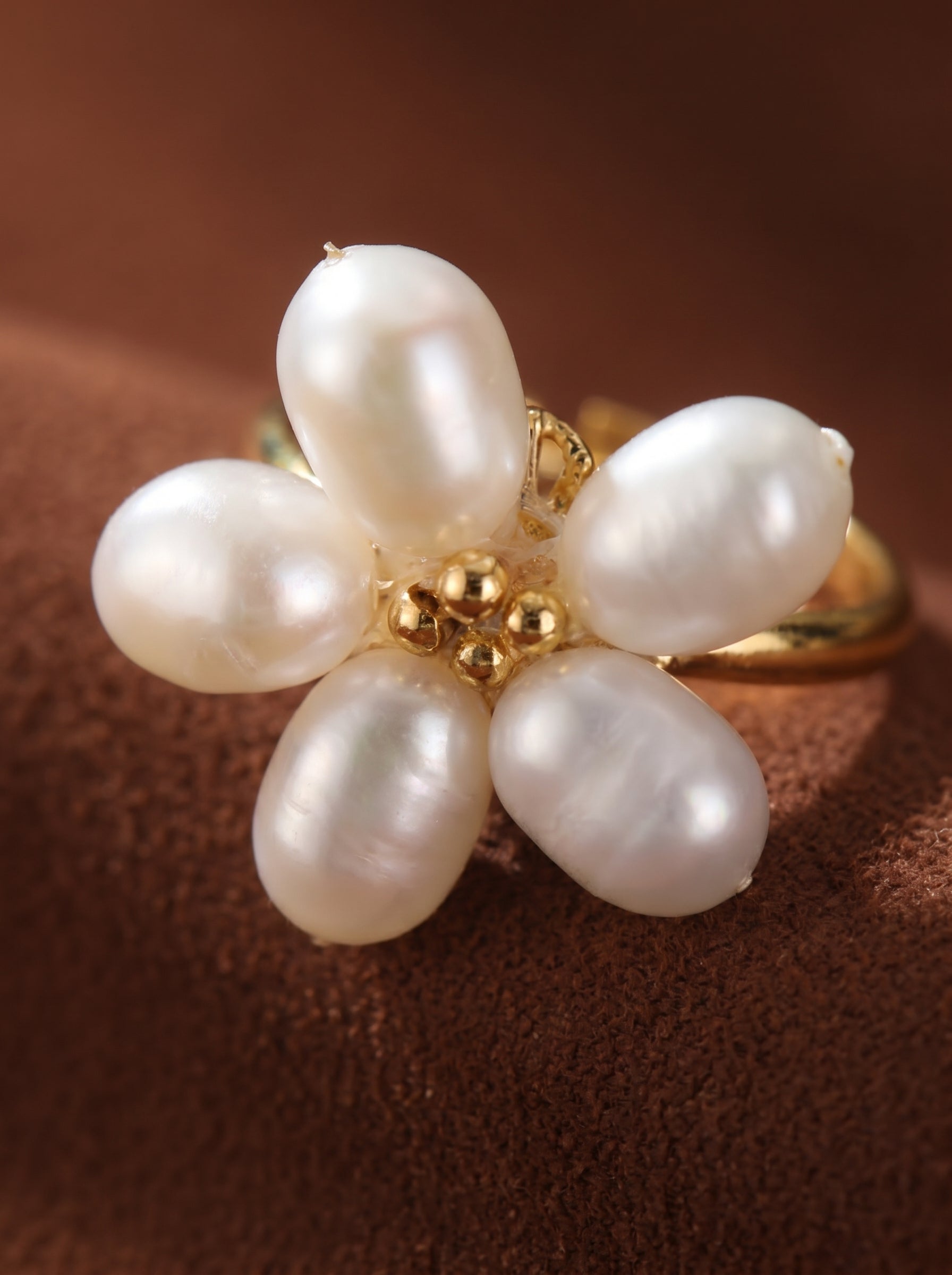 Radiance freshwater pearl flower cuff ring with five baroque pearls and gold bead accents on an adjustable gold band.@pearl