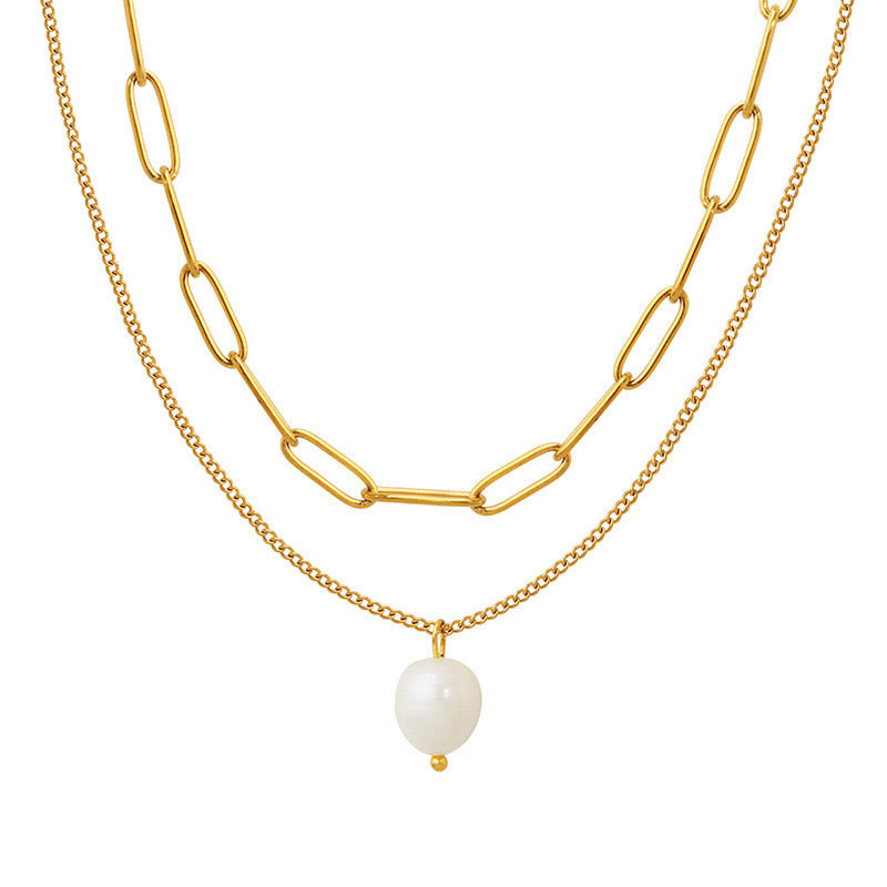 Gold-toned layered necklace with a large paperclip chain and a delicate curb chain, featuring a single white freshwater pearl drop pendant.
