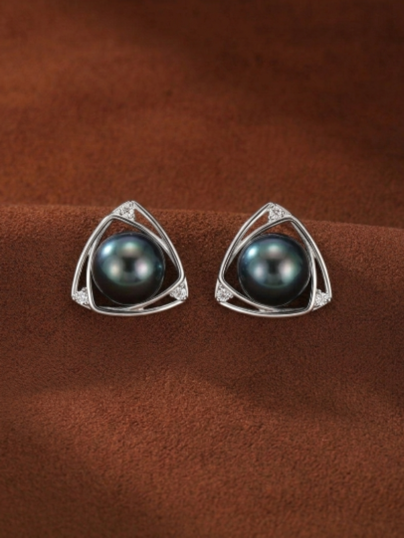 Vertex Tahitian Pearl Triangle Stud Earrings featuring a black 11mm pearl set in an open triangular frame with pavé stones.