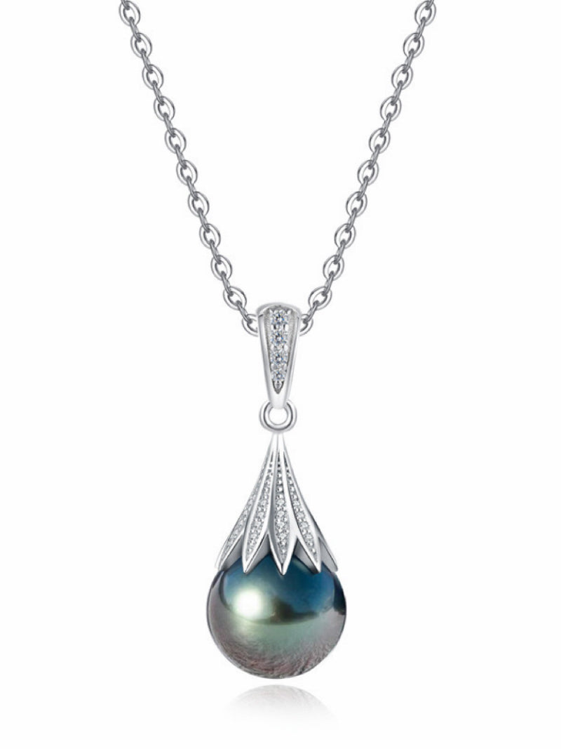 Vortex Tahitian Pearl Drop Necklace featuring a 10mm round black Tahitian pearl with iridescent luster, suspended from a delicate silver chain. The pearl is set in a tapered, pavé-set cap with sparkling details.